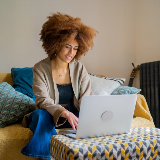 A student working on a laptop at home