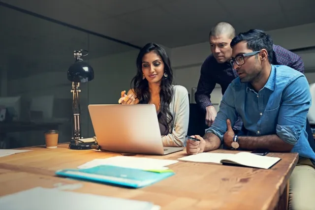 A cross-functional team working through a problem together